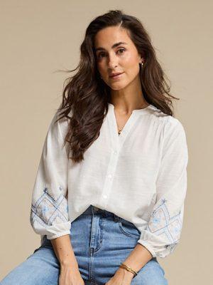 Red Button: white shirt with embroidery on sleeves